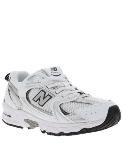 Baskets multisport 530 blanches avec multiples logos de la marques