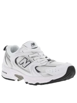 Baskets multisport 530 blanches avec multiples logos de la marques