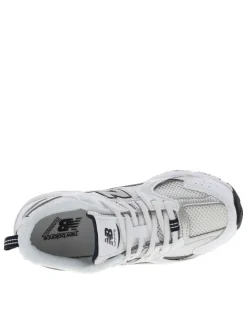 Baskets multisport 530 blanches avec multiples logos de la marques