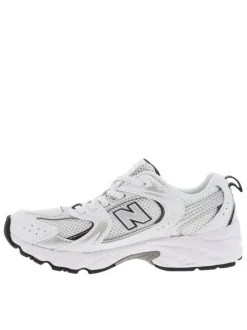 Baskets multisport 530 blanches avec multiples logos de la marques