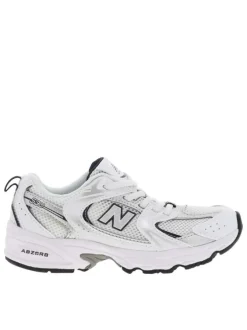Baskets multisport 530 blanches avec multiples logos de la marques