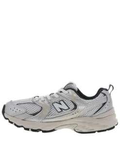 Baskets running blanches à talon plat et en mesh sur le pourtour