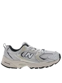 Baskets running blanches à talon plat et en mesh sur le pourtour