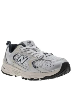 Baskets running blanches à talon plat et en mesh sur le pourtour