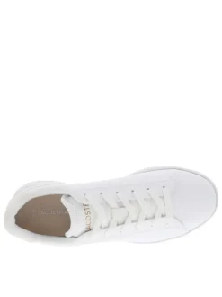 Baskets tennis blanches à talon plat avec logos roses embossés et lacets plats