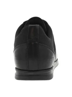 Baskets basses en cuir noir à semelle sneakers à talon plat et à lacets enduis