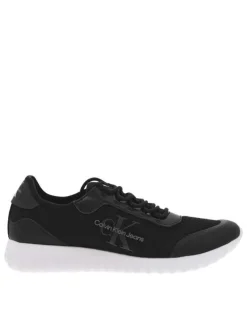 Baskets basses noires avec nom de la marque et monogramme sur l'extérieur