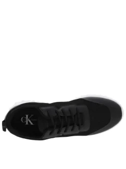 Baskets basses noires à semelle running à talon semi-compensé et tige slip-on