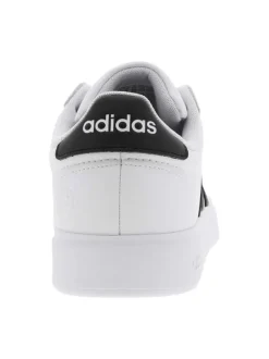 Baskets basses simili cuir blanc avec bandes noires latérales et lacets tressés blancs