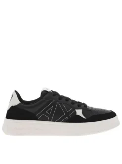 Baskets basses tennis en cuir noir à semelle semi-compensée blanche