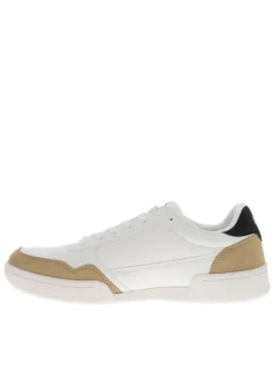 Baskets blanches à talon plat avec des lacets et logo brodé sur le côté