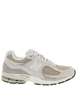 Baskets multisport 2002 beige à talon plat avec du mesh sur le pourtour