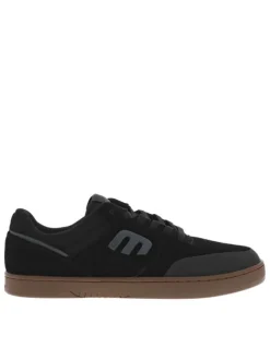 Baskets noires en cuir à talon plat avec des lacets et logo gris
