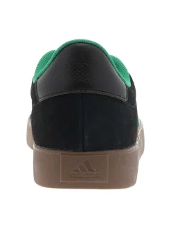 Baskets noires à semelle plate avec un logo tricolore sur le côté