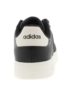 Baskets noires à talon plat avec des lacets et une semelle blanche
