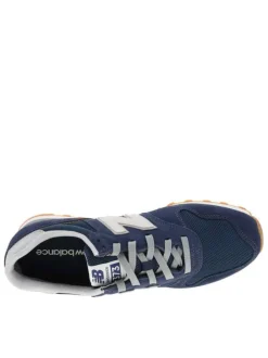 Baskets running 373 bleu marine avec un talon plat et un patch sur la languette