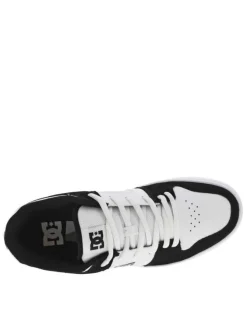 Baskets skate en cuir noires et blanches à talon plat avec des logos noirs