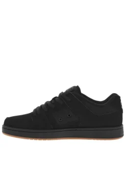 Baskets skate en cuir noires à semelle marron avec des lacets ronds