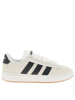 Baskets tennis blanches en cuir avec un talon plat et des lacets