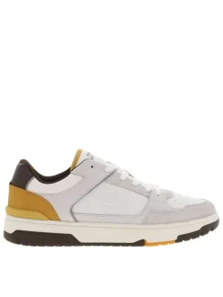 Baskets tennis blanches en cuir à semelle marron avec talon plat et logo embossé