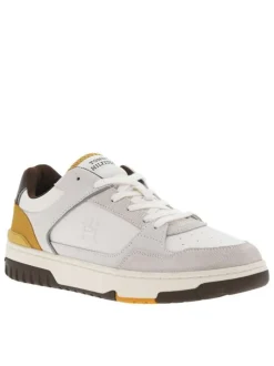 Baskets tennis blanches en cuir à semelle marron avec talon plat et logo embossé