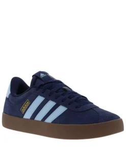 Baskets tennis bleues à talon plat avec un patch de la marque à la languette