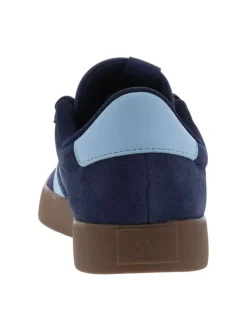 Baskets tennis bleues à talon plat avec un patch de la marque à la languette