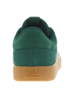 Baskets tennis vertes à semelle marron avec lacets plats et logo blanc