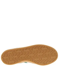 Baskets tennis vertes à semelle marron avec lacets plats et logo blanc