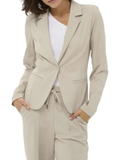 Blazer beige uni pourvu d'une coupe ajustée et d'un col à revers