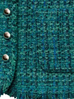 Blazer bleu imprimé avec une coupe droite à col rond et des poches