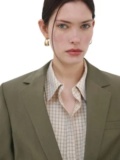 Blazer en coton kaki uni pourvu d'un col à revers et d'une coupe droite