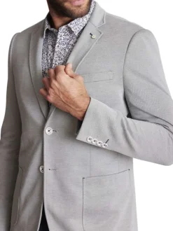 Blazer en maille piquée vert sauge uni à coupe ajustée fermé par deux boutons