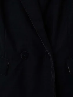 Blazer noir en velours pourvu d'un col tailleur et de manches longues