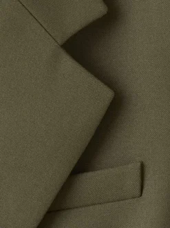 Blazer vert uni avec une coupe droite et un un col cranté à revers