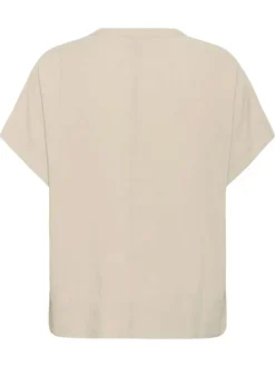 Blouse beige unie pourvue d'un col tunisien et de manches courtes