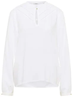 Blouse blanche unie avec un col tunisien et des manches longues