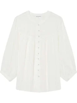 Blouse blanche unie avec une coupe droite et un col rond et des boutons