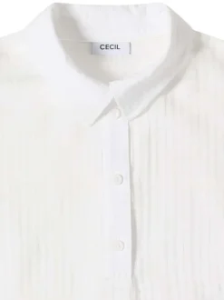 Blouse blanche unie pourvue d'un col boutonnée et de manches courtes
