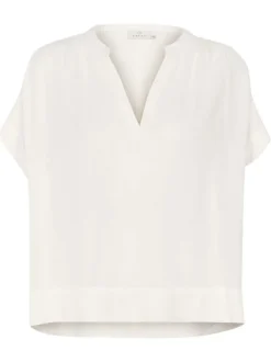 Blouse blanche unie pourvue d'un col tunisien et de manches courtes