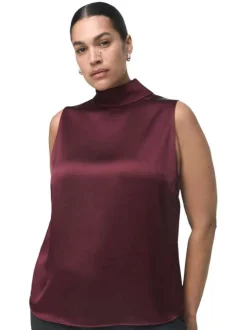 Blouse bordeaux en tissu satiné sans manches pourvue d'un col montant