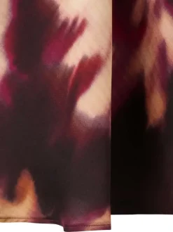 Blouse bordeaux ornée d'un motif floral abstrait et pourvue d'un col rond