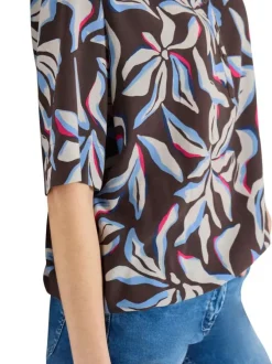 Blouse chocolat à motifs pourvue de manches courtes et d'un col tunisien