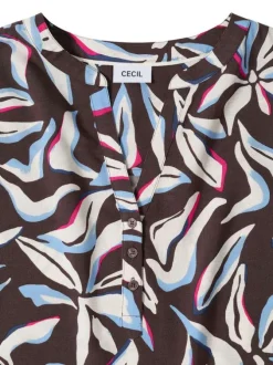 Blouse chocolat à motifs pourvue de manches courtes et d'un col tunisien