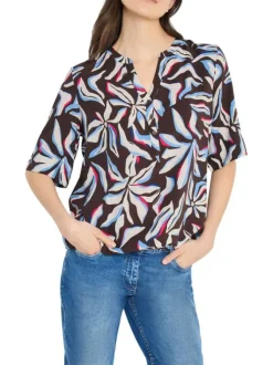Blouse chocolat à motifs pourvue de manches courtes et d'un col tunisien