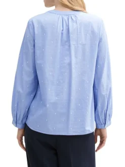Blouse en coton bleue à pois avec une coupe ample et un col v
