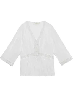 Blouse en coton écrue à détails ajourés avec un col v et des boutons