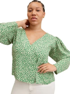 Blouse fluide verte à imprimé floral blanc avec manches longues bouffantes et col v