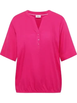 Blouse fuchsia unie pourvue de manches courtes et d'un col tunisien