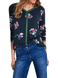 Blouse marine fleurie à col v et à manches longues avec liserés vert